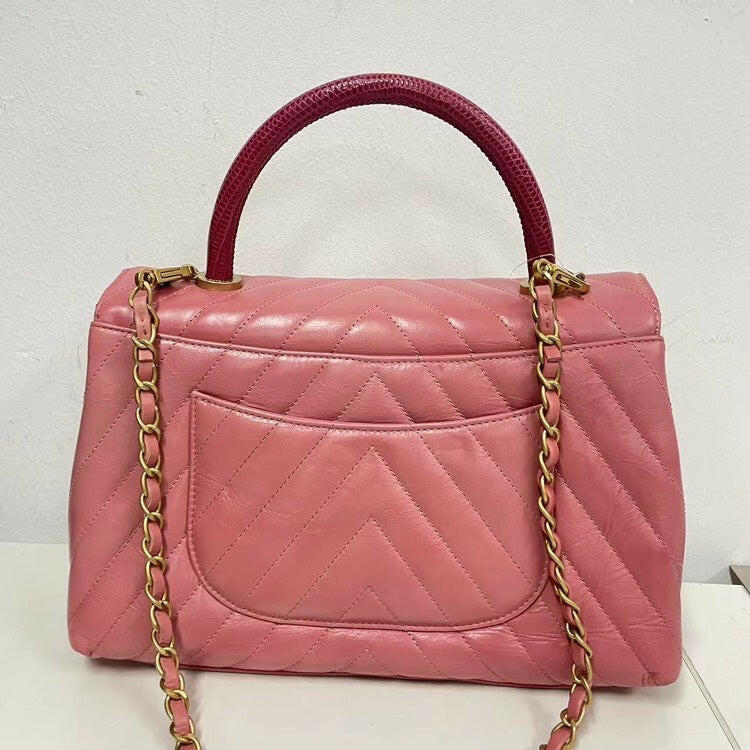 Chanel Coco Handle Bag Pink Quilted Leather with Burgundy Handle and Gold-Tone Hardware.