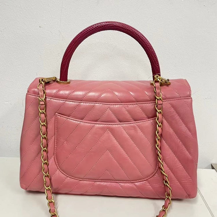 Chanel Coco Handle Bag Pink Quilted Leather with Burgundy Handle and Gold-Tone Hardware.