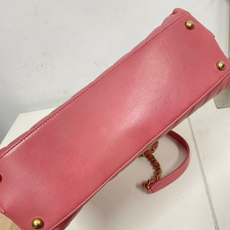 Chanel Coco Handle Bag Pink Quilted Leather with Burgundy Handle and Gold-Tone Hardware.