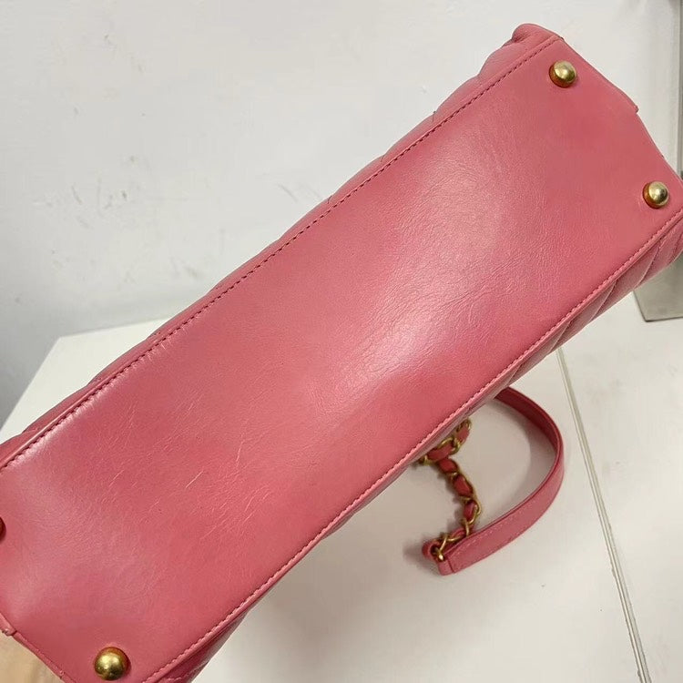 Chanel Coco Handle Bag Pink Quilted Leather with Burgundy Handle and Gold-Tone Hardware.