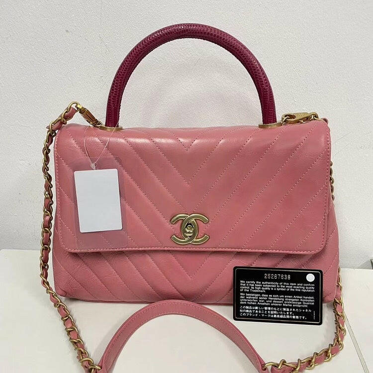Chanel Coco Handle Bag Pink Quilted Leather with Burgundy Handle and Gold-Tone Hardware.