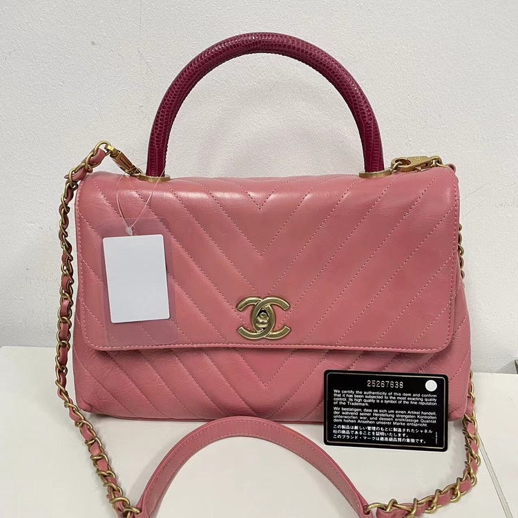 Chanel Coco Handle Bag Pink Quilted Leather with Burgundy Handle and Gold-Tone Hardware.