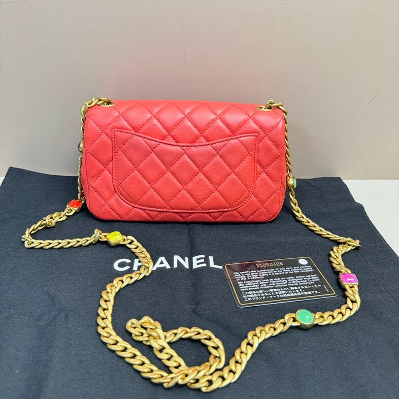 Chanel Red Lambskin Small Flap Bag with Gold Chain.